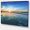 Designart - Blue Seashore with Distant Sunset - Seascape Canvas Art Print
